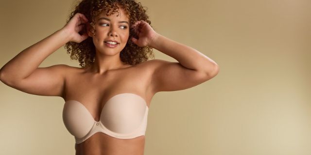 Bride wearing ivory bridal lingerie with expert fit